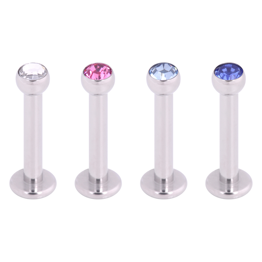 Labret mit Kristall in Silber und Blau Vier silberne Labrets mit klaren, pinken und blauen Kristallen auf weißem Hintergrund